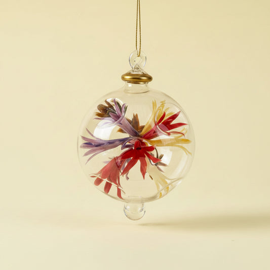 Fair trade hand-blown glass ornament with floral design inspired by Renoir's Bouquet of Chrysantemums, ethically handcrafted