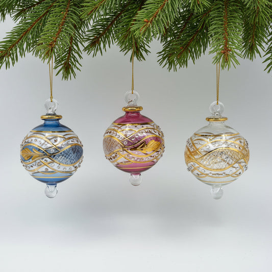 Decorative handblown glass Christmas ornaments with intricate designs and gold hilghlights