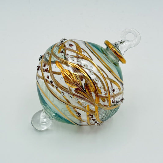 Decorative handblown glass Christmas ornaments with intricate designs and gold hilghlights