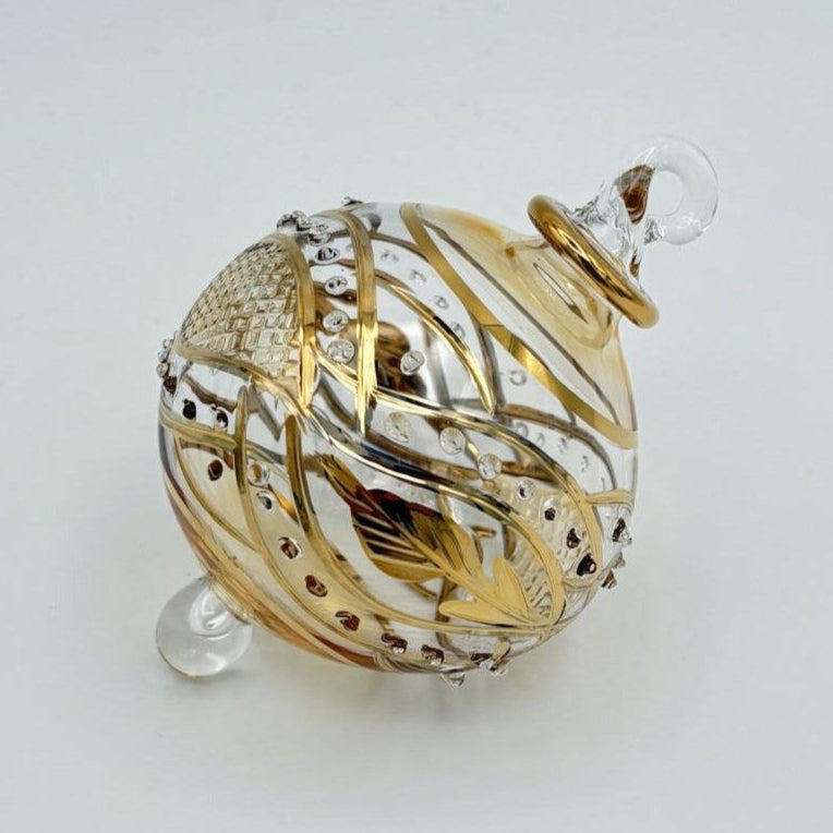 Decorative handblown glass Christmas ornaments with intricate designs and gold hilghlights