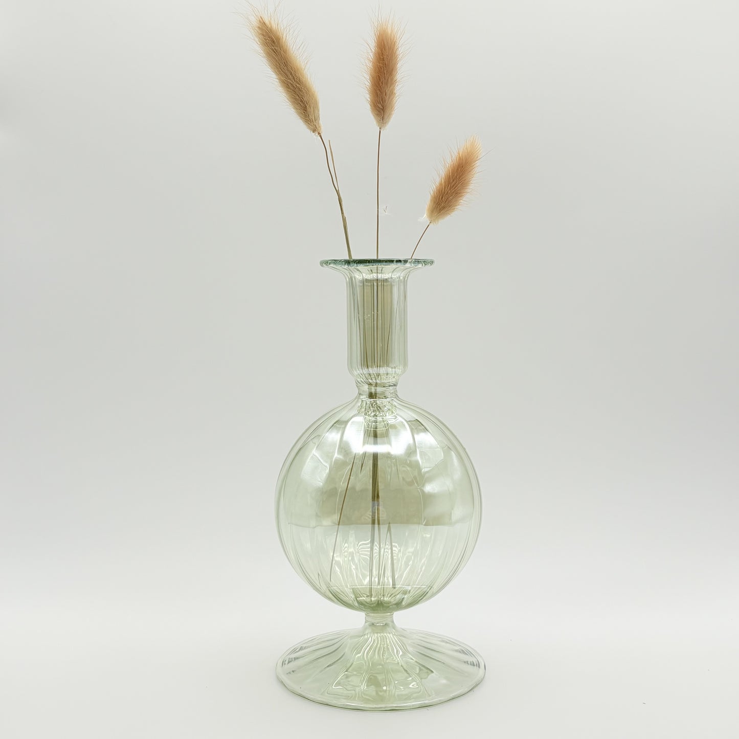 Hand-blown glass bud vase in iridescent green