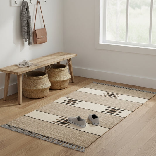 Handwoven wool runner rug with a rustic design, featuring horizontal stripes and geometric patterns in beige, brown, and black. Fair trade handmade