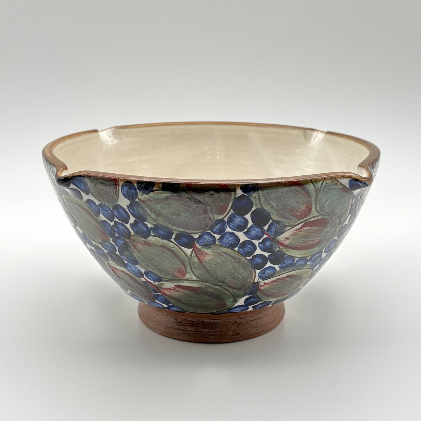 Handmade ethically crafted ceramic bowl with floral pattern