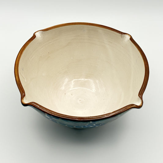 Handcrafted fair trade ceramic bowl with brown rim