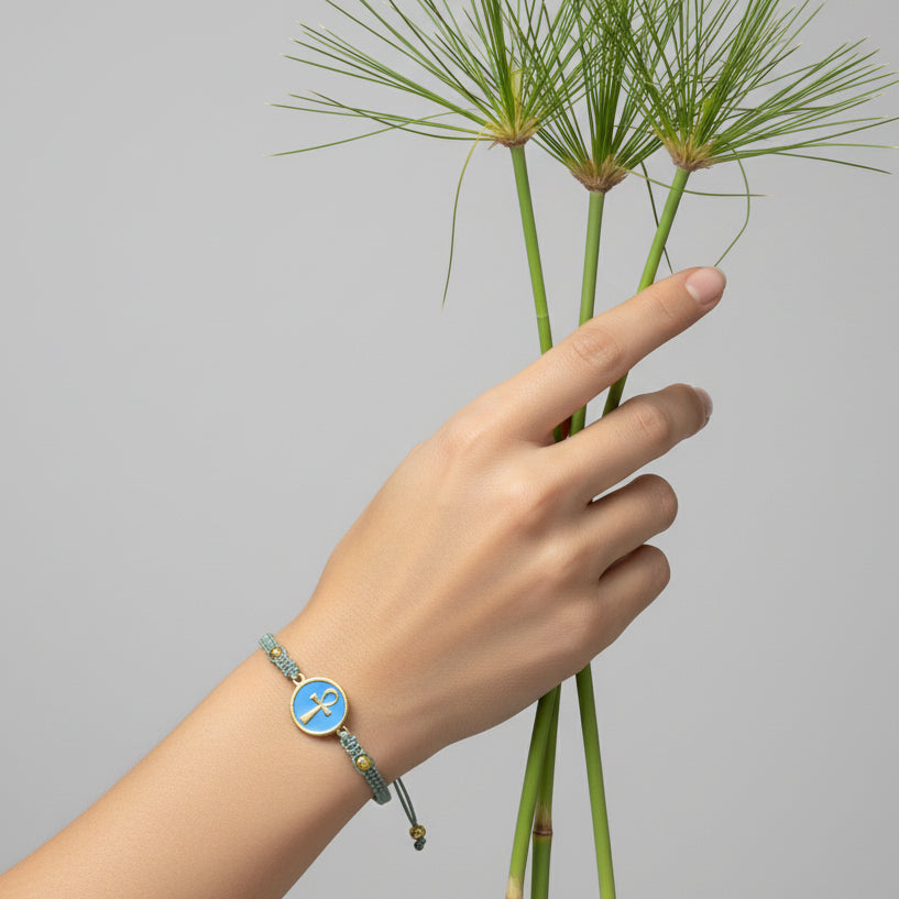 Handmade brass bracelet with an Ankh symbol on a turquoise enamel background