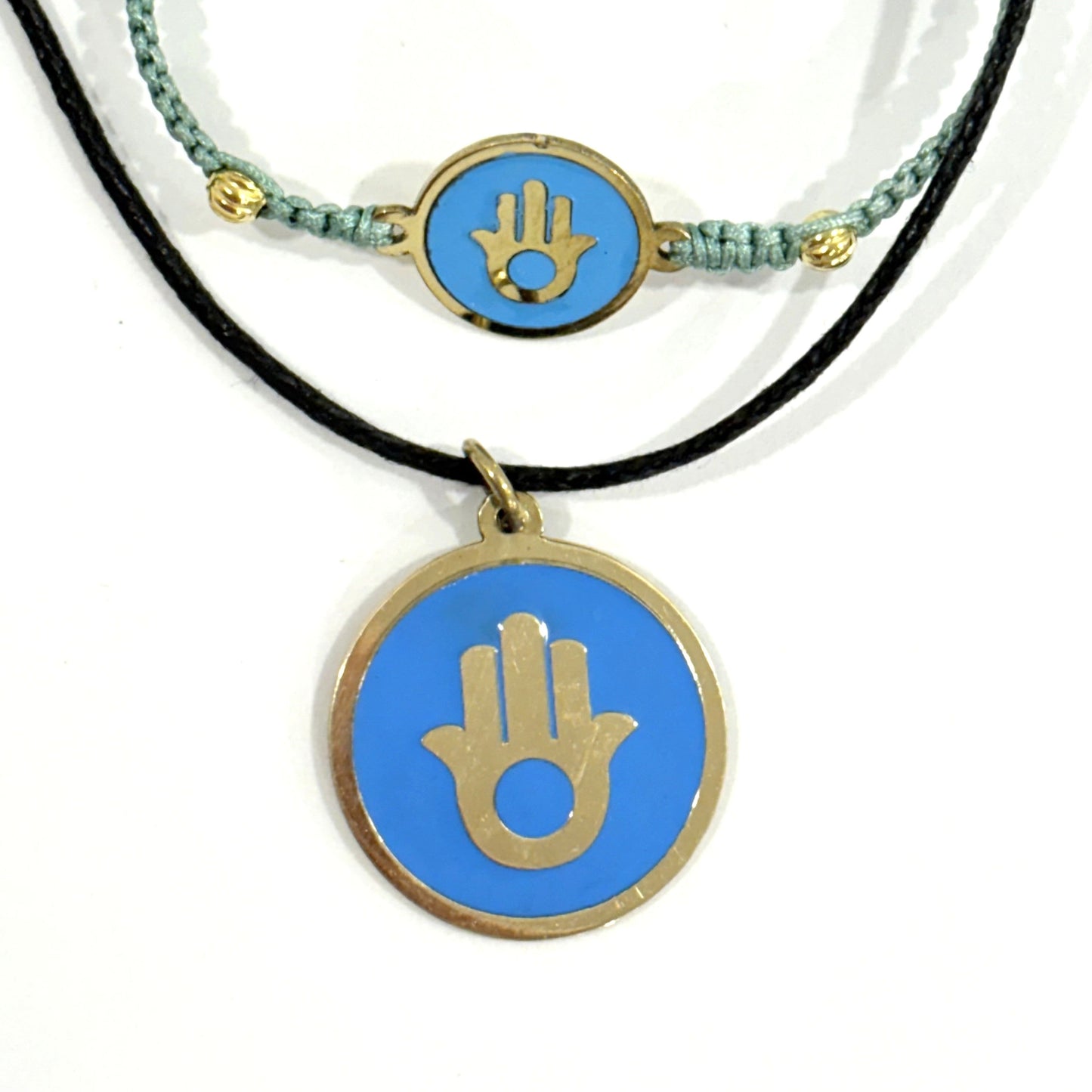 Handmade brass pendant and macrame bracelet with gold Hamsa hand on turquoise enamel on a black cord, fair trade, ethically handmade
