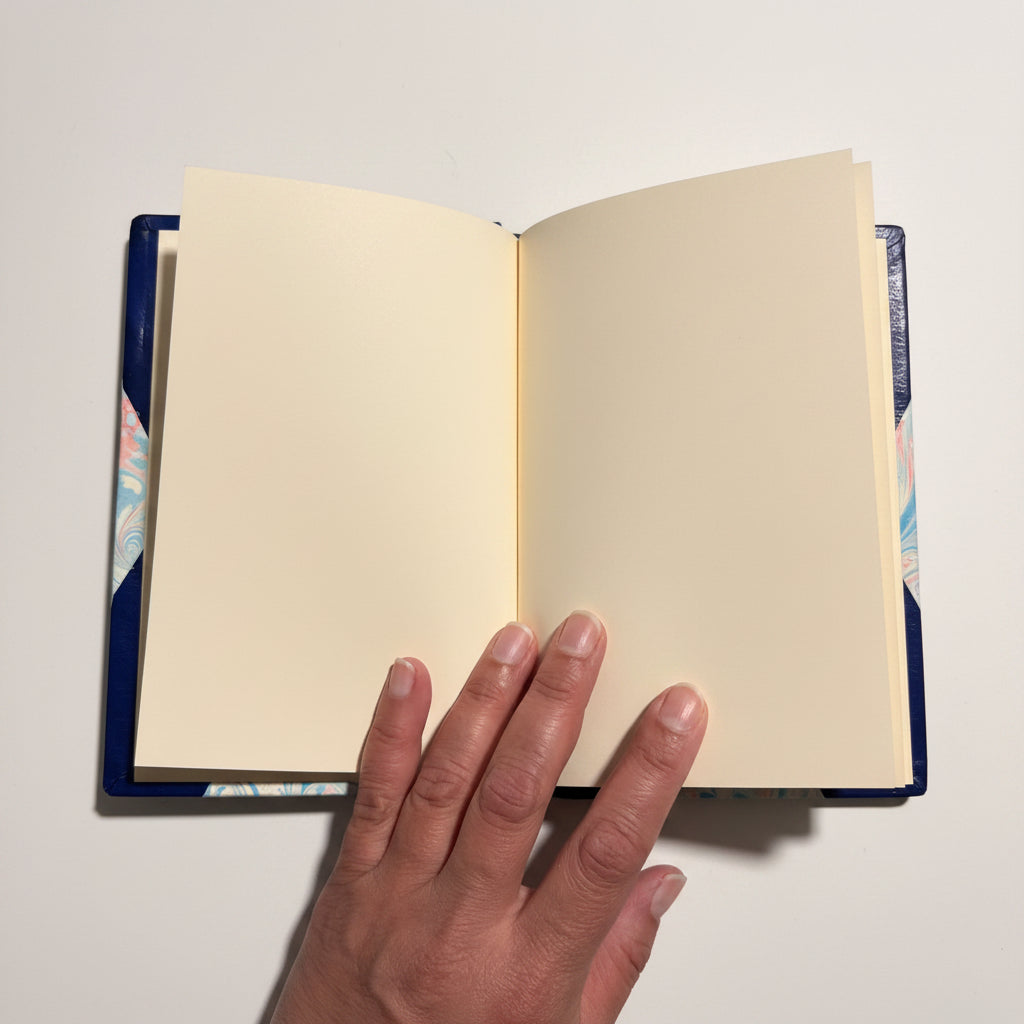 Handcrafted journal notebook with blue leather and marbled paper cover, fair trade