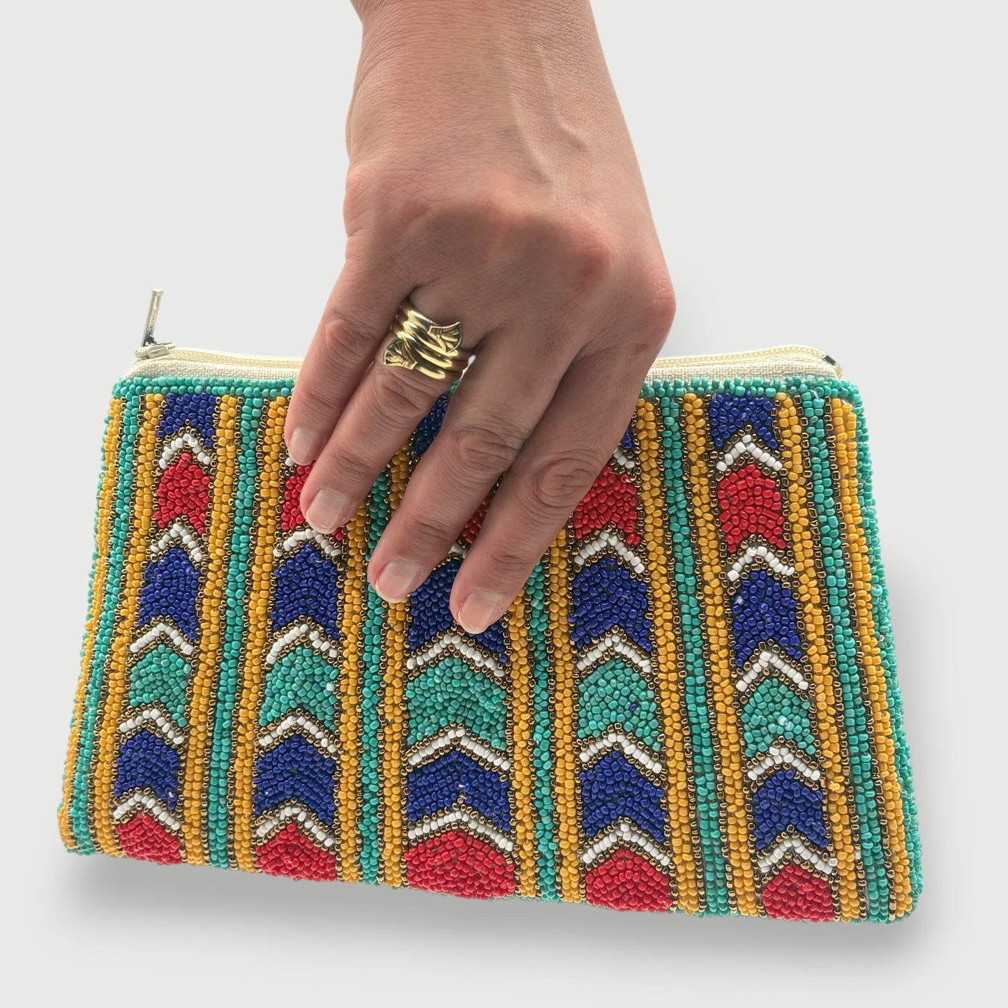 Colorful fair trade hand-beaded clutch with geometric chevron design