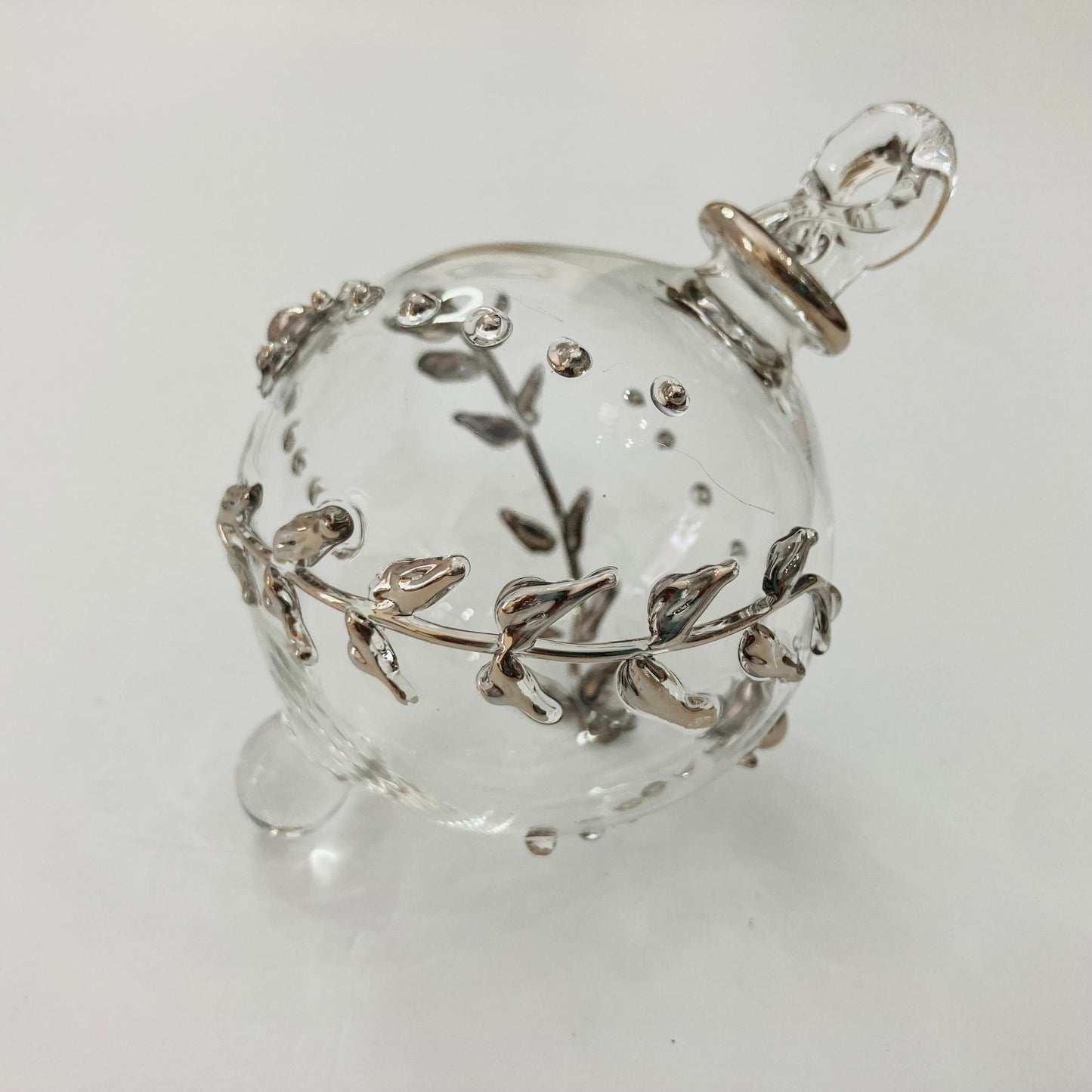 Clear handblown glass bauble Christmas ornament with silver leaf and flower design