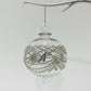 Decorative handblown glass bauble ornament with hand etchings and silver embellishments 