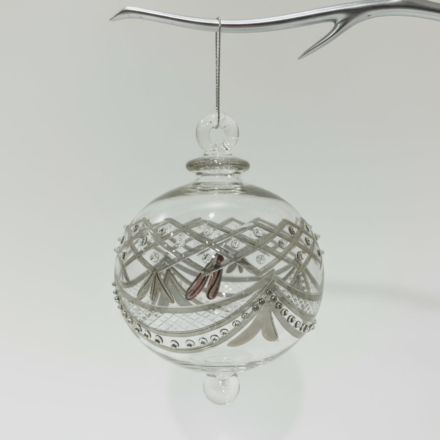Decorative handblown glass bauble ornament with hand etchings and silver embellishments 