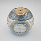 Fair trade handblown glass candle holder with intricate patterns, gold detail and blue rim, ethically handmade