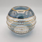 Fair trade handblown glass candle holder with intricate patterns, gold detail and blue rim, ethically handmade