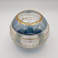 Fair trade handblown glass candle holder with intricate patterns, gold detail and blue rim, ethically handmade