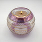 Fair trade handblown glass candle holder with intricate patterns, gold detail and pink rim, ethically handmade