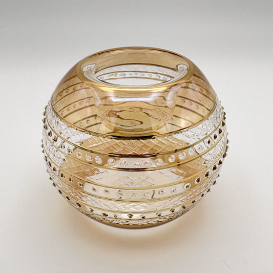 Fair trade handblown glass candle holder with intricate patterns, gold detail and yellow rim, ethically handmade