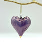 Purple heart-shaped handblown glass ornament with gold tip