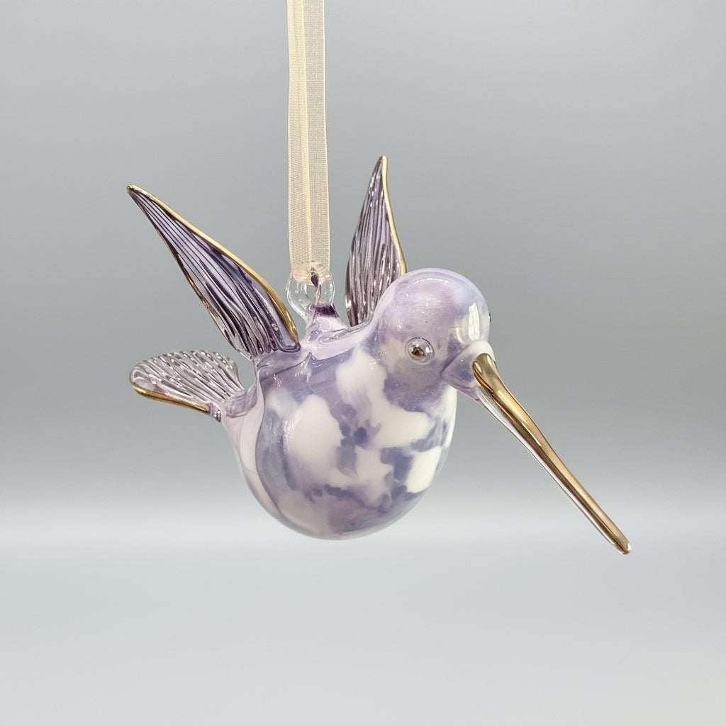 Blown glass lavender and white hummingbird ornament with gold accents, fair trade