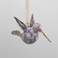 Blown glass lavender and white hummingbird ornament with gold accents, fair trade