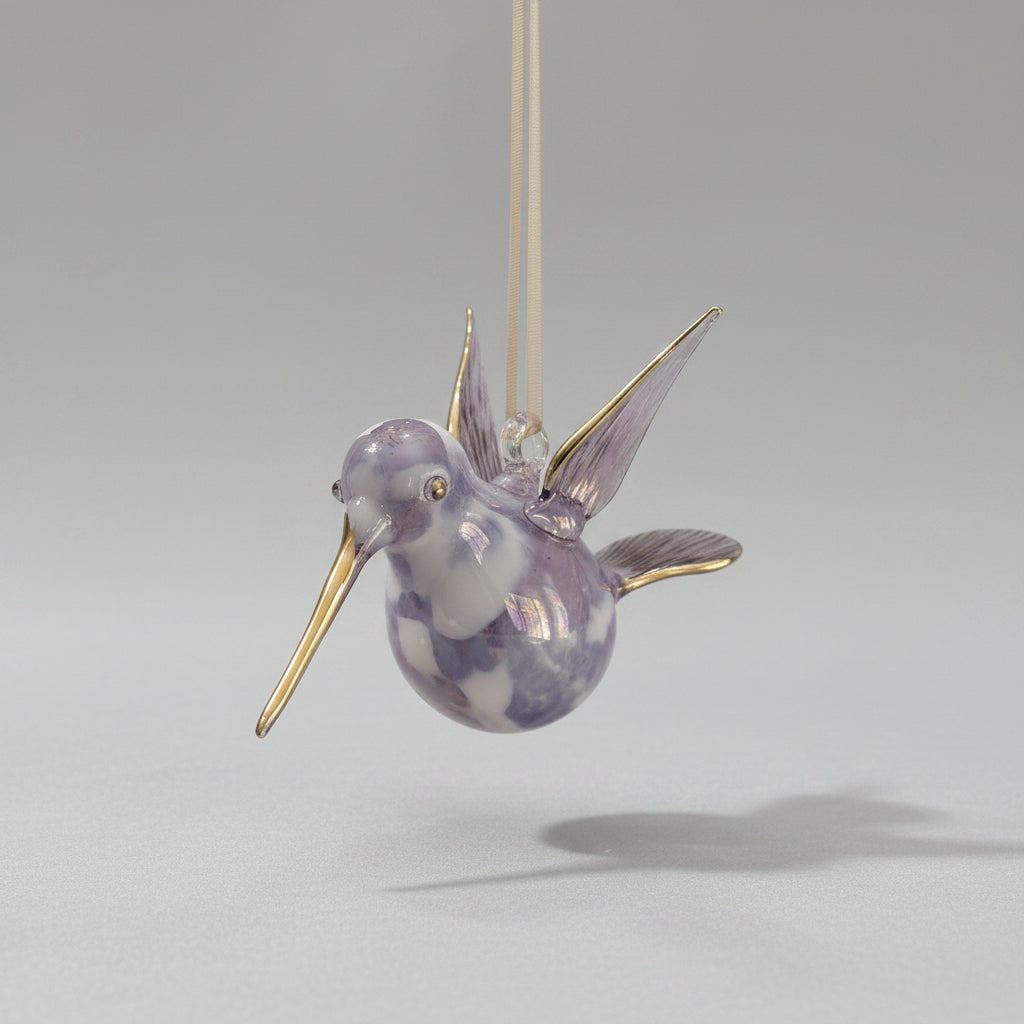 Blown glass lavender and white hummingbird ornament with gold accents, fair trade