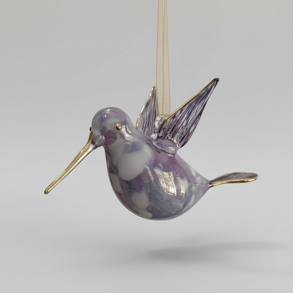 Blown glass lavender and white hummingbird ornament with gold accents, fair trade