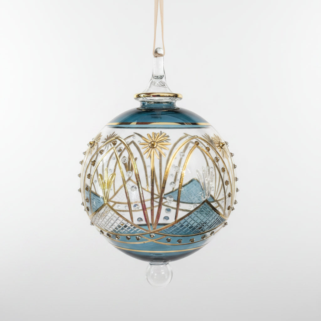 Hand-blown glass bauble ornament with a blue and gold painted design