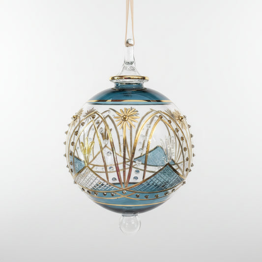 Hand-blown glass bauble ornament with a blue and gold painted design