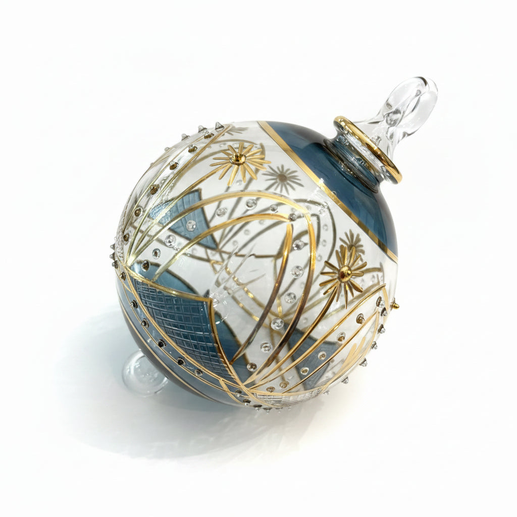Hand-blown glass bauble ornament with a blue and gold painted design