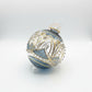 Hand-blown glass bauble ornament with a blue and gold painted design