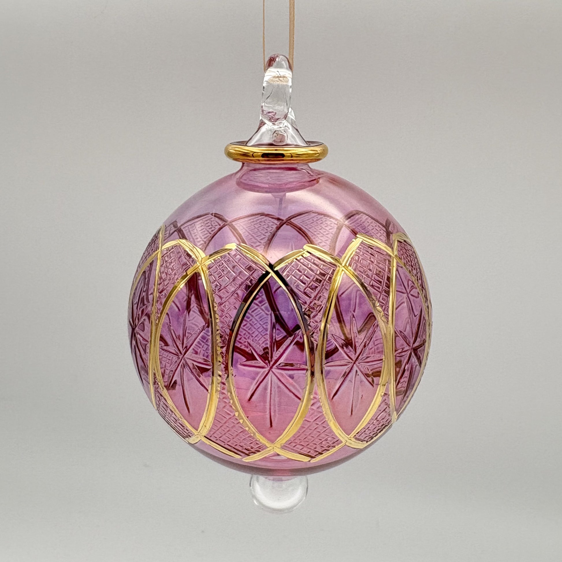 Fair trade handblown glass pink ornament with stars and lozenges etched pattern and gold detail, ethically handmade