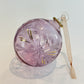 Blown glass bauble ornament with a pink tint and gold detail, featuring etched flowers