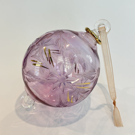 Blown glass bauble ornament with a pink tint and gold detail, featuring etched flowers