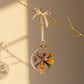 Decorative blown glass ornament with floral design inspired from Klimt's The Kiss painting, fair trade