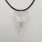 Heart-shaped iridescent clear hand-blown glass pendant on a black cord