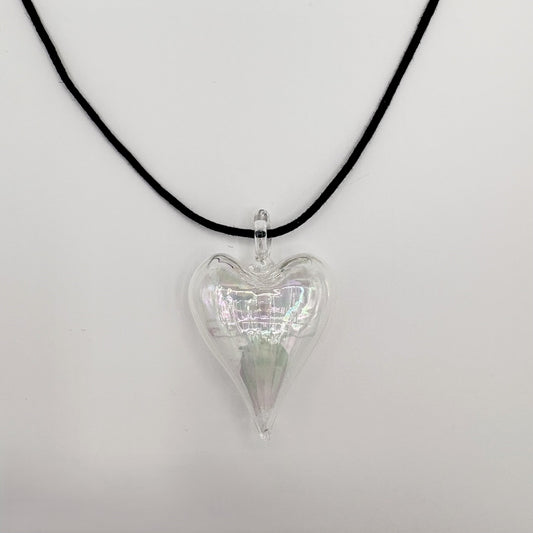 Heart-shaped iridescent clear hand-blown glass pendant on a black cord