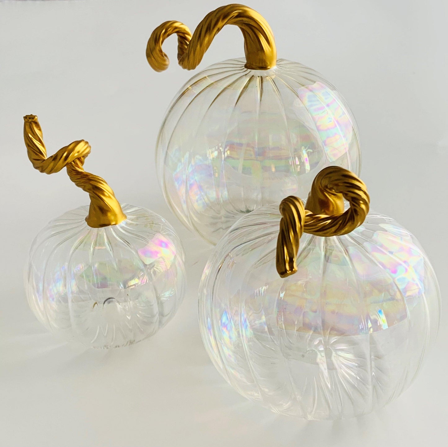 Clear iridescent handblown glass pumpkins with gold stems 