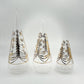Decorative handblown glass cone shpaed trees with gold and silver star and leaf patterns in three sizes