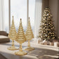 Decorative handblown glass iridescent yellow Christmas trees with gold highlights, ethically handcrafted