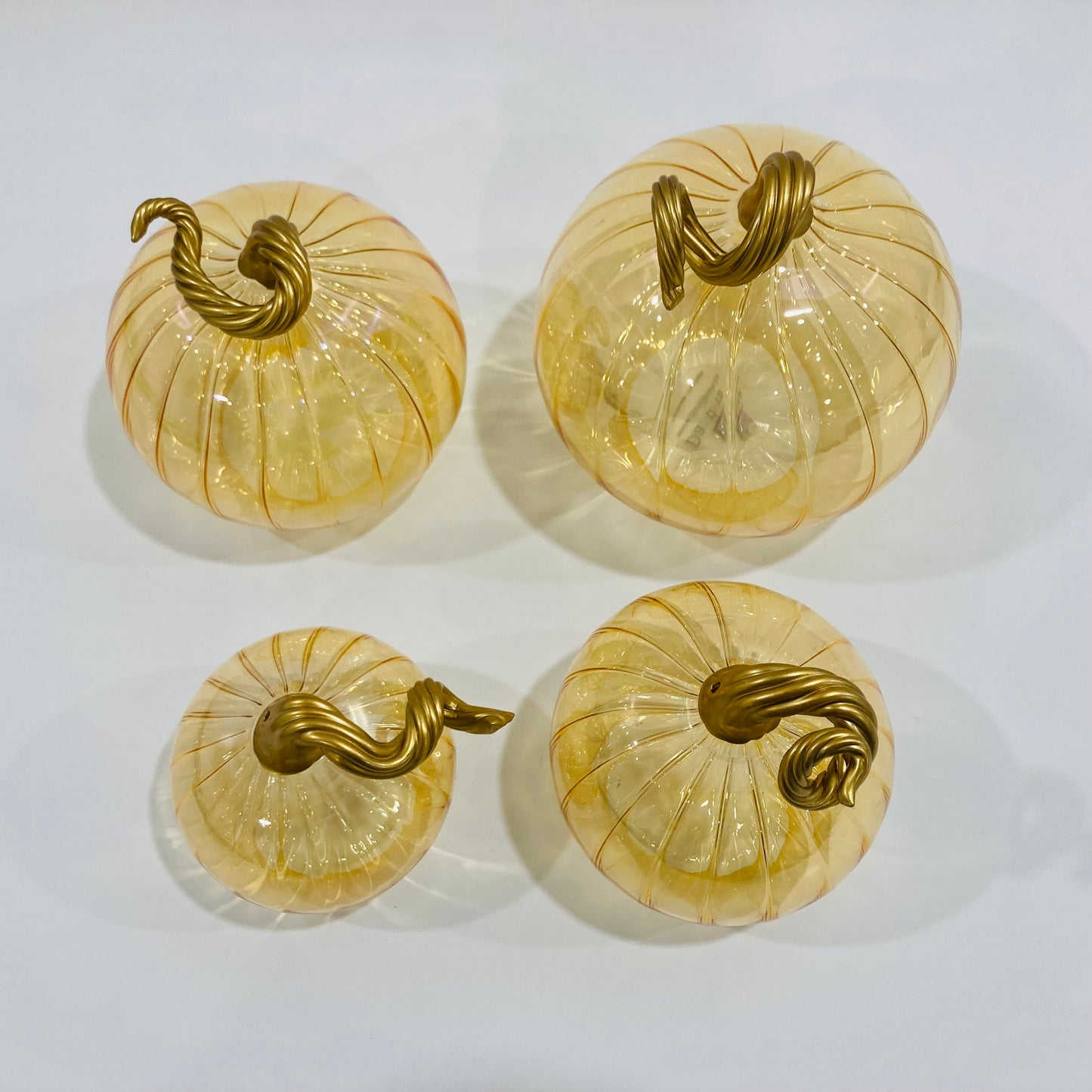 Hand-blown glass iridescent amber pumpkins with gold stems