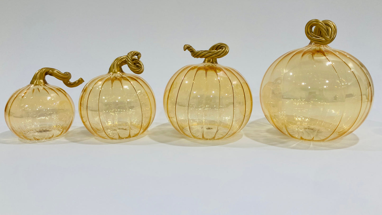 Hand-blown glass iridescent amber pumpkins with gold stems