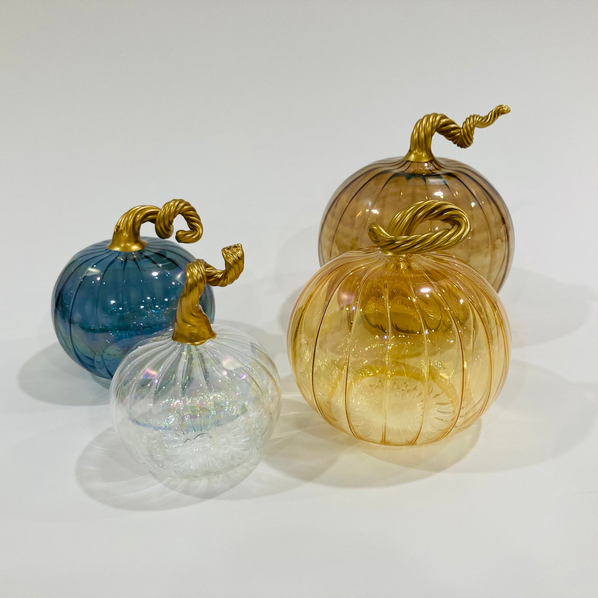 Hand-blown glass iridescent amber pumpkins with gold stems