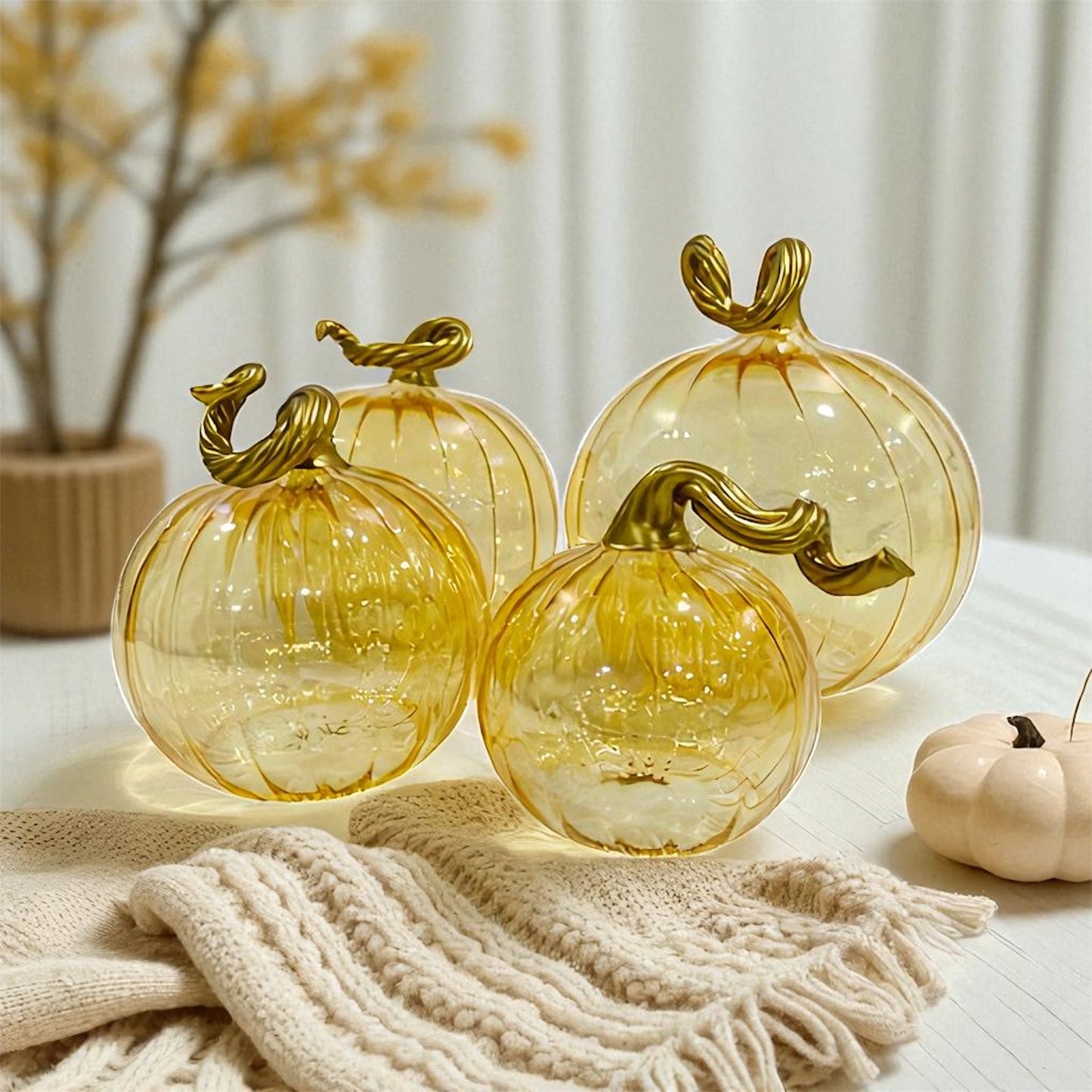 Hand-blown glass iridescent amber pumpkins with gold stems
