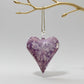 Blown glass heart-shaped ornament  with marbled white and lavender design, fair trade