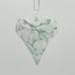 Heart-shaped ornament with green and white marbled pattern 