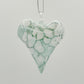 Heart-shaped ornament with green and white marbled pattern 