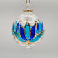 Fair trade handblown glass ornament with blue and turquoise colored lotus and gold detail, ethically handmade