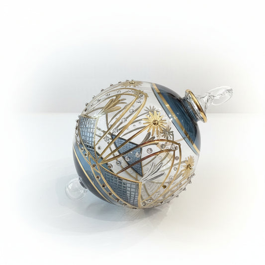 Hand-blown glass bauble ornament with a blue and gold painted design