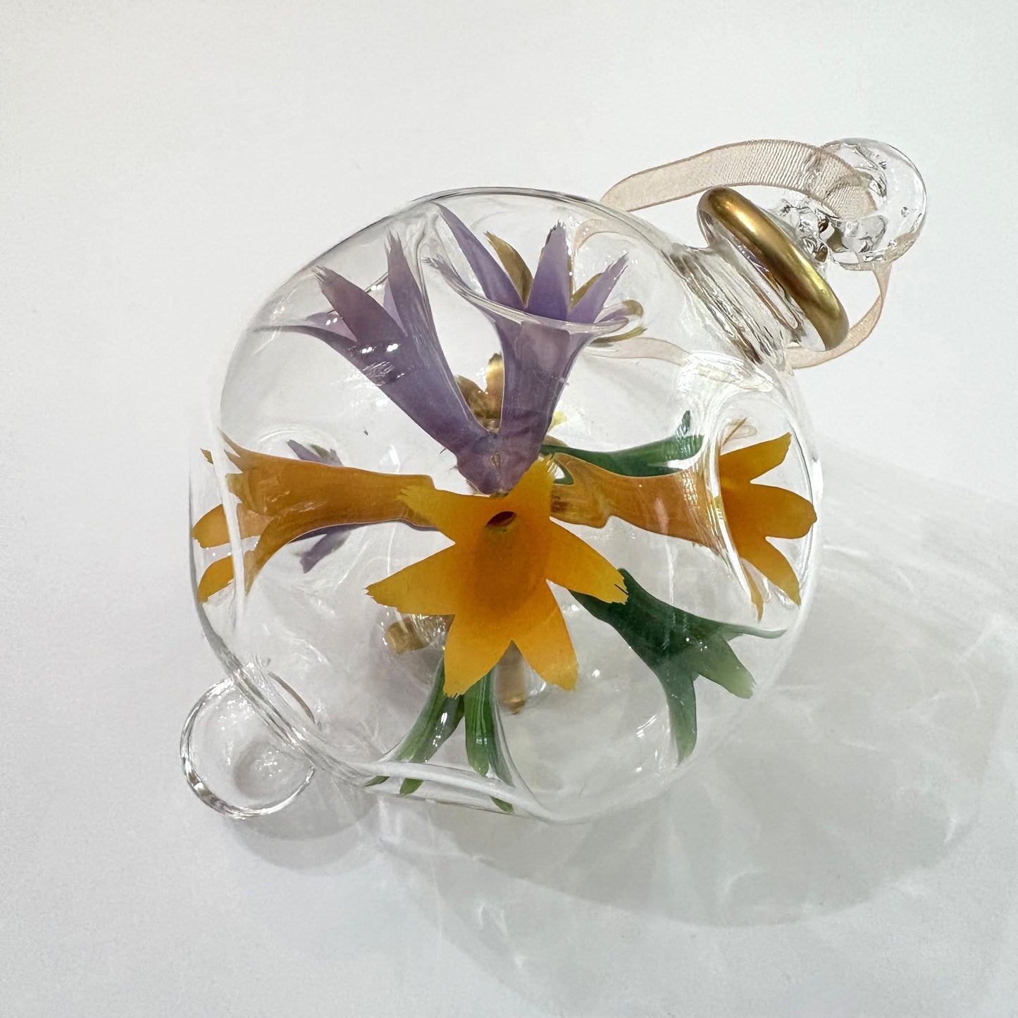 Decorative blown glass ornament with floral design inspired from Klimt's The Kiss painting, fair trade