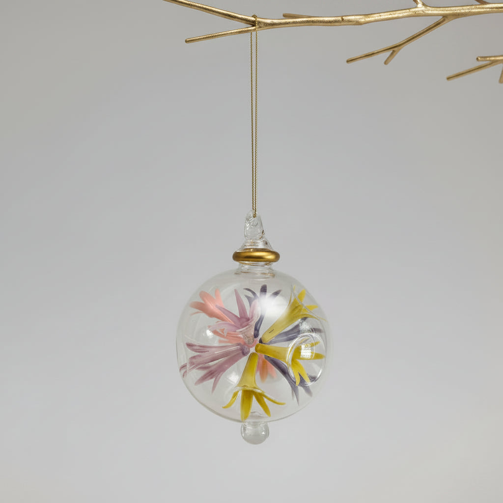 Hand-blown glass bauble ornament with floral design on a transparent background, fair trade handcrafted