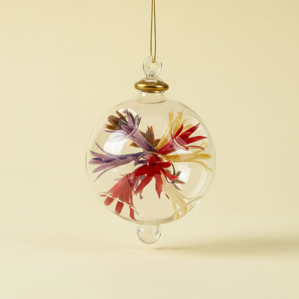Fair trade hand-blown glass ornament with floral design inspired by Renoir's Bouquet of Chrysantemums, ethically handcrafted